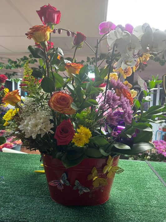 Basket with Multicolor Roses, Lydia Orchids, Pneumonia Flowers & Ruscus – Colorful Garden Basket